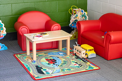 Toys and child-size sofas are seen in the Family Room in the newly renovated JSCC Learning Commons.