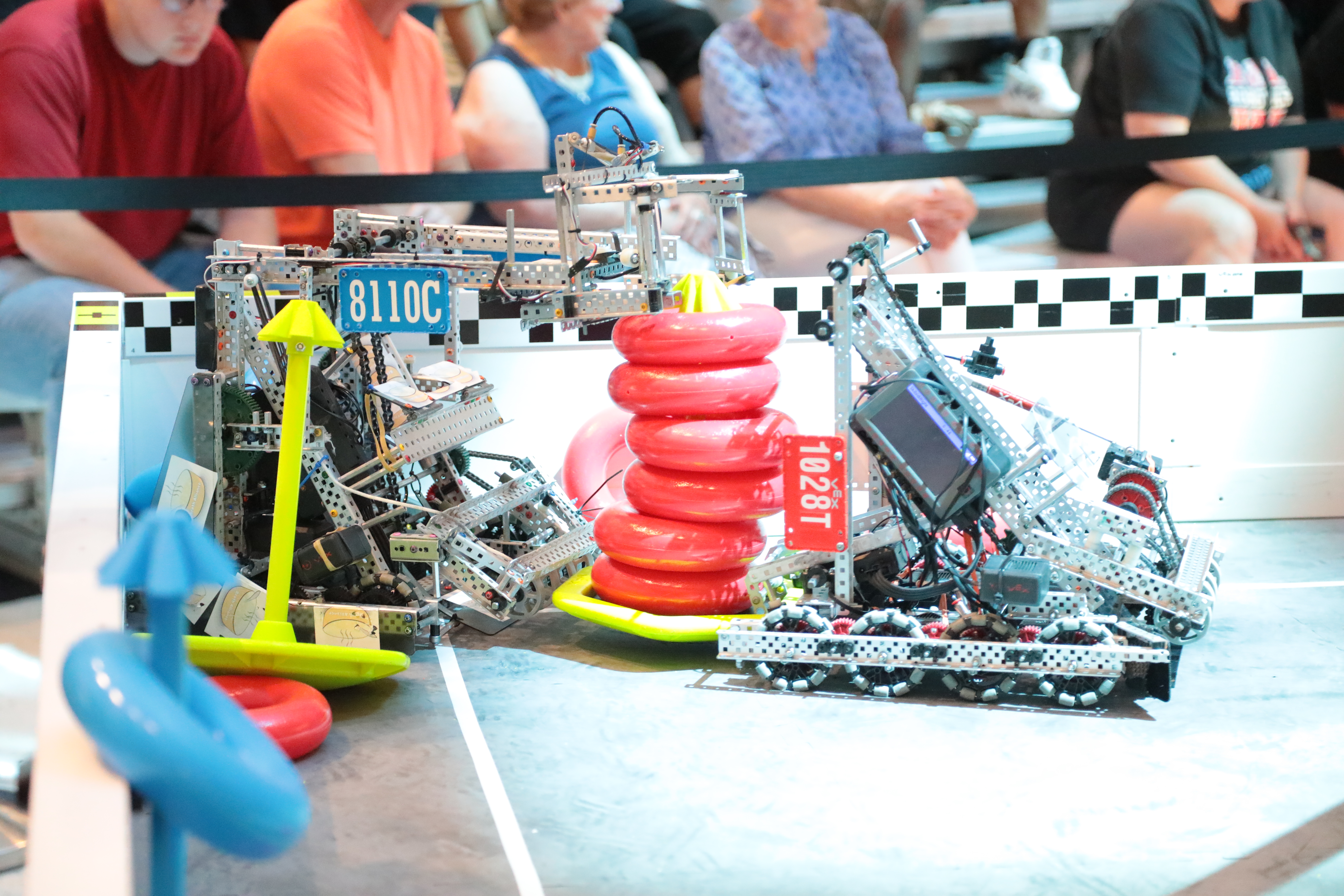 Two robots battle to win a VEX Robotics Competition.